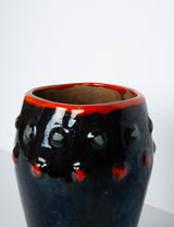 Glossy vase with red polka dots